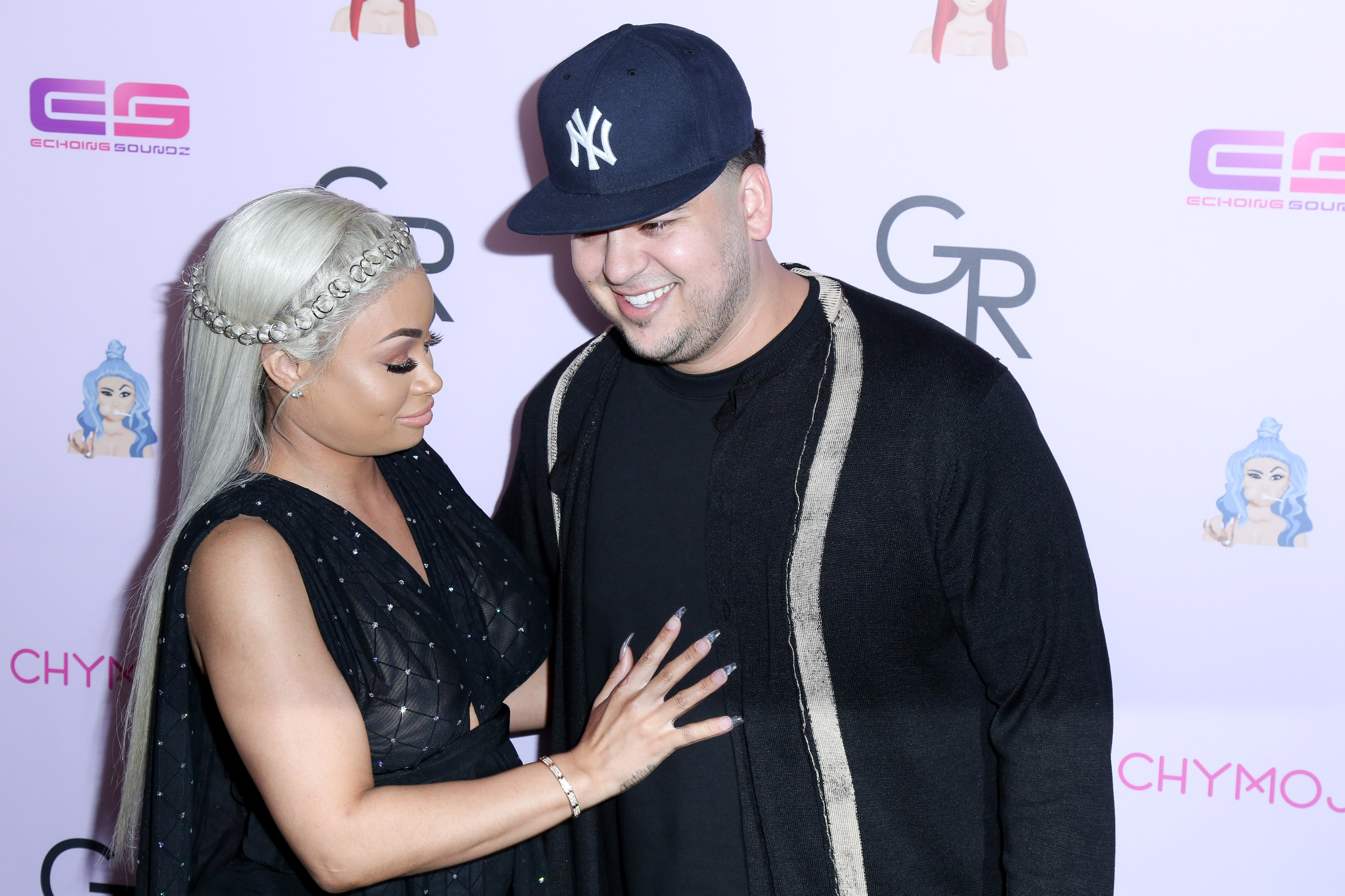 Blac Chyna and Rob Kardashian look happy as can be as they arrive on the purple carpet for her birthday party / Chymoji (emoji) release party at the Hard Rock Cafe in Hollywood, CA