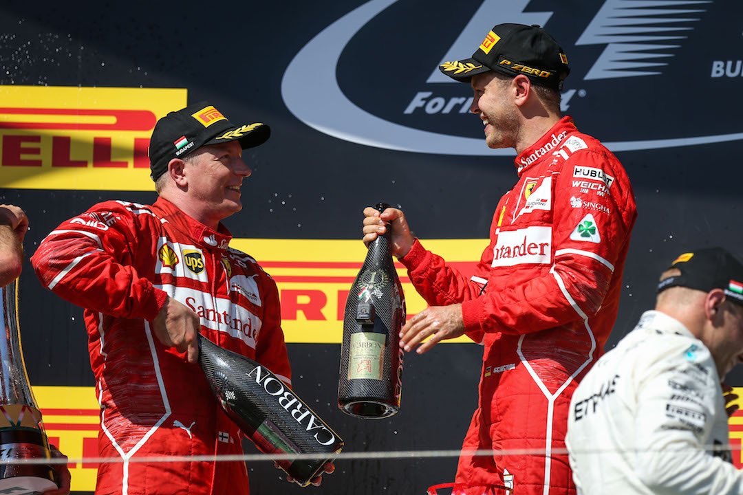 Kimi Raikkonen junto a Sebastian Vettel